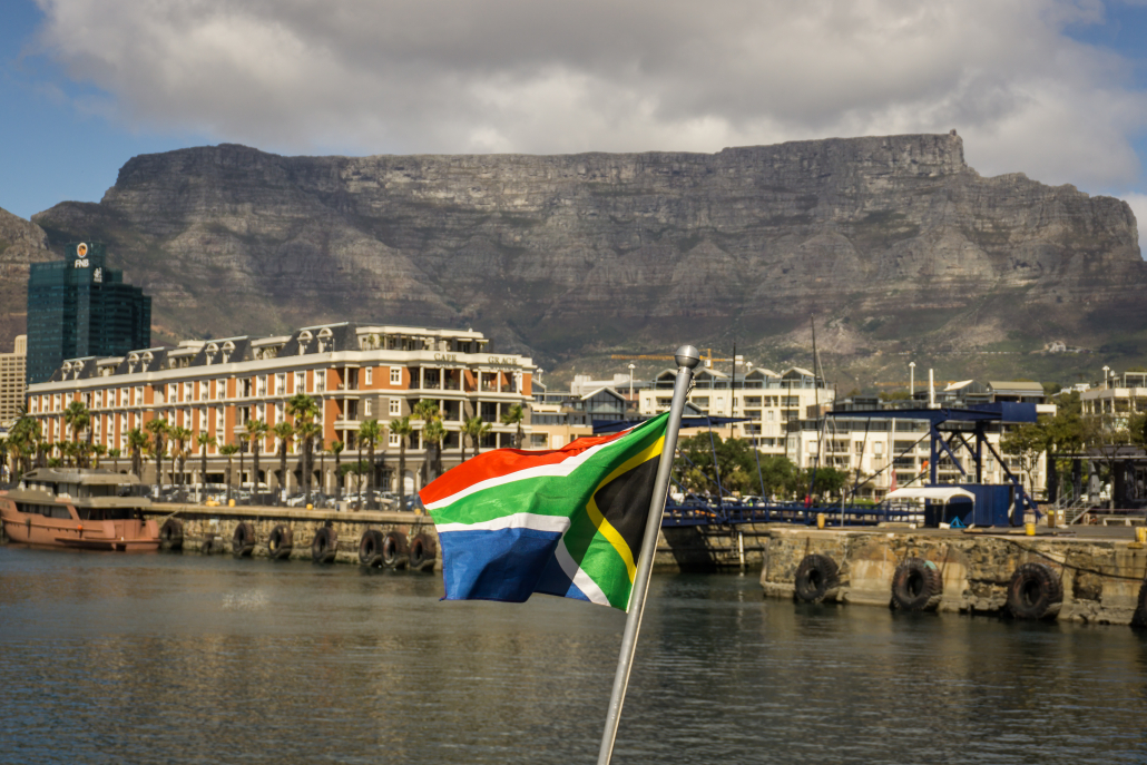 multi-colored-flags-mountain-against-sky